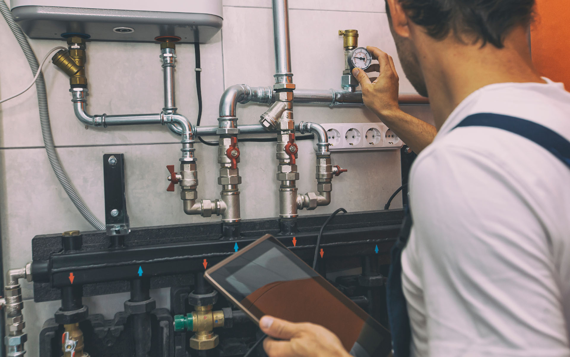 The,Technician,Checking,The,Heating,System,In,The,Boiler,Room